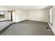 Open living area with neutral carpet and trim at 126 S Mustin Dr, Anderson, IN 46012