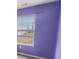 Vibrant purple bedroom featuring a window with blinds and natural light at 12840 Patrick Ct, Fishers, IN 46038