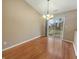 Cozy dining area featuring wood floors and a sliding glass door to the backyard at 12840 Patrick Ct, Fishers, IN 46038