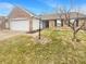 Charming home featuring a two-car garage, brick facade, and a well-manicured front yard at 12840 Patrick Ct, Fishers, IN 46038
