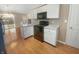 Well-maintained kitchen with white cabinets and a view to the outdoor patio at 12840 Patrick Ct, Fishers, IN 46038