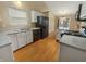 Functional kitchen with white cabinets and modern appliances, creating a clean and efficient cooking space at 12840 Patrick Ct, Fishers, IN 46038