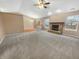 Open living room showcasing a fireplace and large windows that provide an abundance of natural light at 12840 Patrick Ct, Fishers, IN 46038