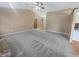 Spacious living room with vaulted ceiling and neutral carpet, ready for personalization at 12840 Patrick Ct, Fishers, IN 46038