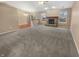 Spacious living room with cozy fireplace, large windows, and adjacent dining area, ideal for comfortable living at 12840 Patrick Ct, Fishers, IN 46038