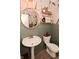 Charming powder room with a pedestal sink, decorative mirror, and stylish wall accents at 1307 Peregrine Ln, Greenwood, IN 46143