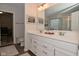 Bathroom featuring double vanity and a view to the toilet and a baby crib at 1307 Peregrine Ln, Greenwood, IN 46143