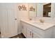 Elegant bathroom with double vanity, white countertops, and modern fixtures with lake themed decor at 1307 Peregrine Ln, Greenwood, IN 46143
