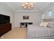 Well-lit bedroom with a comfortable bed, a desk, tv and stylish decor at 1307 Peregrine Ln, Greenwood, IN 46143