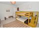 Charming bedroom featuring a yellow bunk bed and coordinating neutral decor at 1307 Peregrine Ln, Greenwood, IN 46143
