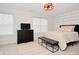 Well-lit bedroom featuring a dresser, accent wall, carpet flooring, and neutral decor at 1307 Peregrine Ln, Greenwood, IN 46143
