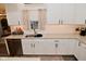 Well-lit kitchen featuring white cabinetry, stainless steel appliances, and subway tile backsplash at 1307 Peregrine Ln, Greenwood, IN 46143