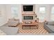 Cozy living room features a modern fireplace, neutral color palette, and plenty of natural light at 1307 Peregrine Ln, Greenwood, IN 46143