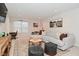 Relaxing living room features a comfortable gray couch, a patterned rug, and decorative touches at 1307 Peregrine Ln, Greenwood, IN 46143