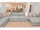 Comfortable living room with a large gray sectional sofa and a view into the modern kitchen at 1307 Peregrine Ln, Greenwood, IN 46143