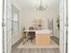 Stylish office boasts natural light, a modern desk, and chic decor, creating a functional and inviting workspace at 1307 Peregrine Ln, Greenwood, IN 46143