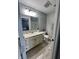 Well-lit bathroom with single vanity and shower with glass doors, offering a clean and functional space at 1347 Preserve Ct, Greenwood, IN 46143