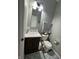 Small bathroom includes a decorative vanity with a mirror and a toilet at 1347 Preserve Ct, Greenwood, IN 46143