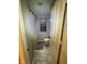Narrow bathroom includes a shower, toilet, and tile flooring at 1347 Preserve Ct, Greenwood, IN 46143