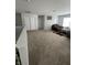 Upstairs bonus room with neutral carpet, light gray walls, and lots of natural light from the window at 1347 Preserve Ct, Greenwood, IN 46143