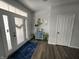 Welcoming foyer with decorative front doors, hardwood floors, and stylish accents at 1347 Preserve Ct, Greenwood, IN 46143