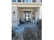 Charming front porch featuring brick columns, a decorative door, and a cozy seating area at 1347 Preserve Ct, Greenwood, IN 46143