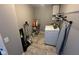 Functional laundry room with a washer, dryer, and storage shelving at 1347 Preserve Ct, Greenwood, IN 46143
