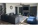 Spacious living room features a stone fireplace, large sectional sofa, and modern decor at 1347 Preserve Ct, Greenwood, IN 46143