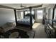 Spacious main bedroom with a four-poster bed, lots of natural light, and tray ceiling at 1347 Preserve Ct, Greenwood, IN 46143