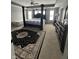 Main bedroom with a four poster bed frame, decorative area rug, and carpet flooring at 1347 Preserve Ct, Greenwood, IN 46143