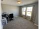 Bright room that can be used as an office with natural light and neutral walls at 1347 Preserve Ct, Greenwood, IN 46143