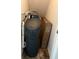 Compact utility closet with a water softener system and storage at 1347 Preserve Ct, Greenwood, IN 46143