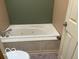 A jetted tub in the bathroom showcasing potential for a relaxing spa-like experience at home at 1437 E Pleasant Run Pkwy S Dr, Indianapolis, IN 46203