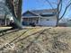 Charming two-story home with a covered porch and mature trees in a quiet neighborhood at 1437 E Pleasant Run Pkwy S Dr, Indianapolis, IN 46203