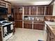 Well-equipped kitchen with warm wood cabinets and plenty of counter space, perfect for cooking at 1437 E Pleasant Run Pkwy S Dr, Indianapolis, IN 46203