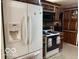 Bright kitchen with stainless steel appliances and ample storage, designed for culinary enthusiasts at 1437 E Pleasant Run Pkwy S Dr, Indianapolis, IN 46203