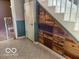Unique staircase with built-in wooden drawers for storage, adding character and functionality to the home's design at 1437 E Pleasant Run Pkwy S Dr, Indianapolis, IN 46203