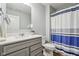 Well-lit bathroom with a shower, vanity, and mirror at 14904 Tiago Ln, Fishers, IN 46040