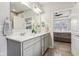 Elegant bathroom featuring double vanity with quartz countertop and wood tile flooring at 14904 Tiago Ln, Fishers, IN 46040