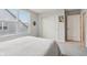 Bright bedroom with soft carpet and natural light shining through a large window at 14904 Tiago Ln, Fishers, IN 46040