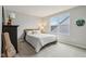 Cozy bedroom with natural light, a comfortable queen bed, and tasteful decor at 14904 Tiago Ln, Fishers, IN 46040