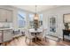 Cozy dining area with modern furnishings, natural light, and convenient access to the outdoor patio at 14904 Tiago Ln, Fishers, IN 46040