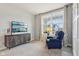 Home office featuring a sleeper chair, large window, and television at 14904 Tiago Ln, Fishers, IN 46040