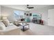 This comfy living room has ample seating, a ceiling fan, and a window with neighborhood view at 14904 Tiago Ln, Fishers, IN 46040