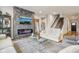 Stylish living room features a stone fireplace, hardwood floors and neutral decor at 14904 Tiago Ln, Fishers, IN 46040