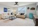 Inviting living room with bright window, comfortable sofas, and tasteful decor at 14904 Tiago Ln, Fishers, IN 46040
