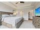 Comfortable main bedroom with a tray ceiling and neutral decor at 14904 Tiago Ln, Fishers, IN 46040