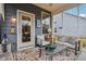 Screened in patio with comfortable seating and view of landscaped backyard at 14904 Tiago Ln, Fishers, IN 46040