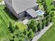 Backyard aerial view of pool, patio area, putting green, and outdoor living space at 15694 Provincial Ln, Fishers, IN 46040