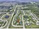 Aerial view of neighborhood featuring community ponds, green spaces, and well-manicured lawns at 15694 Provincial Ln, Fishers, IN 46040
